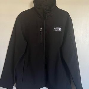 Black North Face zip up jacket